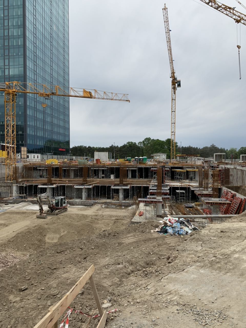 High-rise construction site with tower cranes